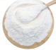 Close up powdered HEDP 98% in a wooden bowl with a spoon