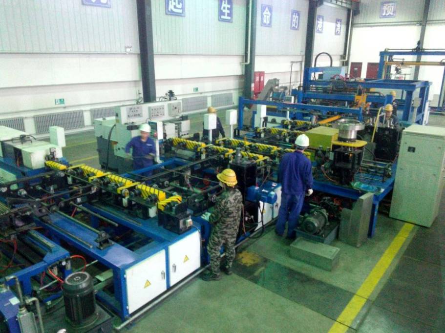 Image of workers in a factory coordinating international shipment.