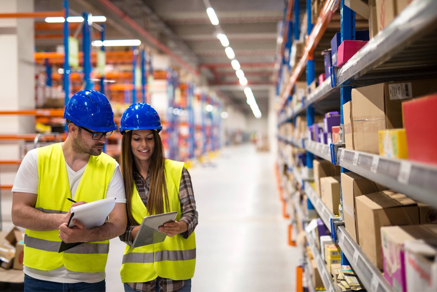 Warehouse workers reviewing chloroprene rubber supply chain and inventory status
