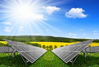 Solar panels in a green grassy area