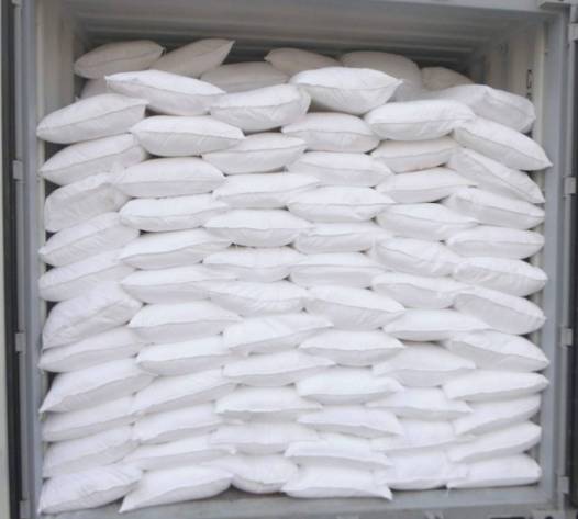 Large quantities of sodium hydroxide loaded in container ready to be shipped.