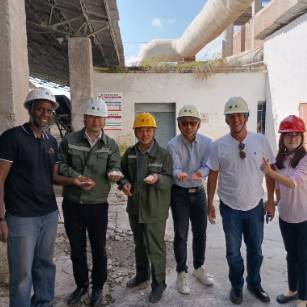 Team of workers, smiling. 