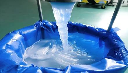 Sodium lauryl ether sulfate (SLES) in bulk paste form being filled into a drum