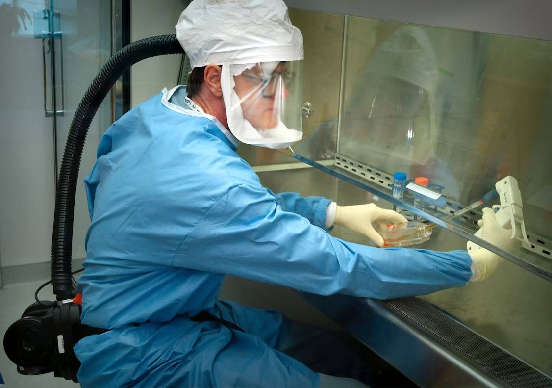 Animal nutritionist inspecting mineral feed with Sodium Selenite