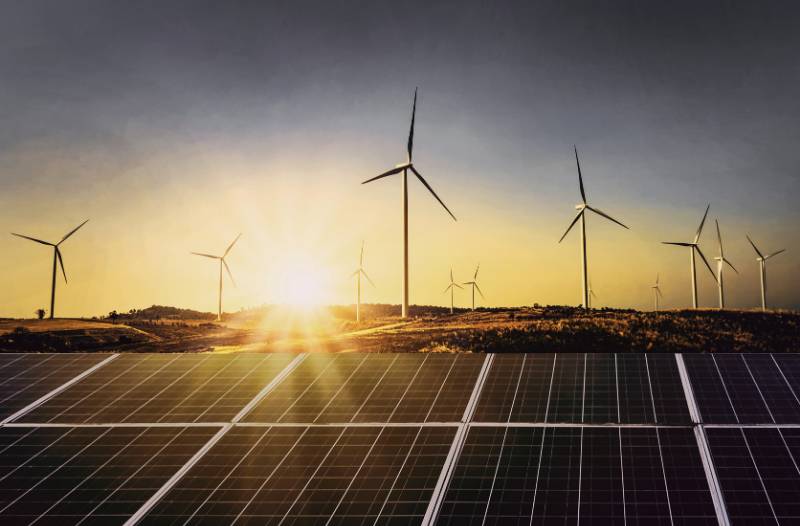 Windmills over solar panels 