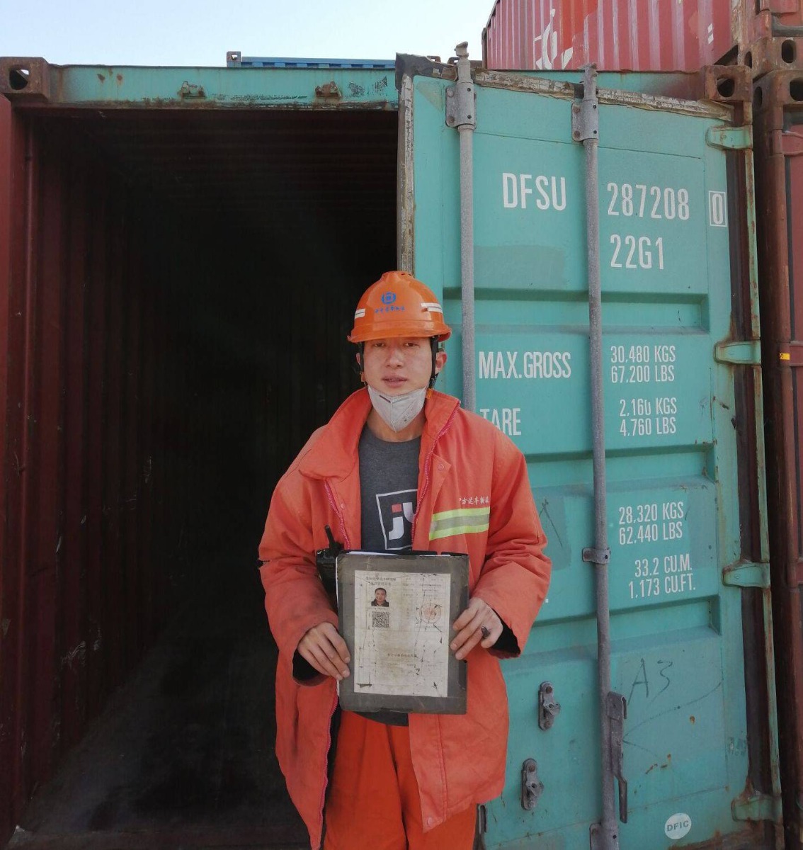Camachem's employee holding shipment documents