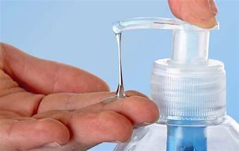 bottle of sanitizer poured into hands